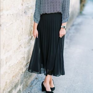 Black pleated midi skirt